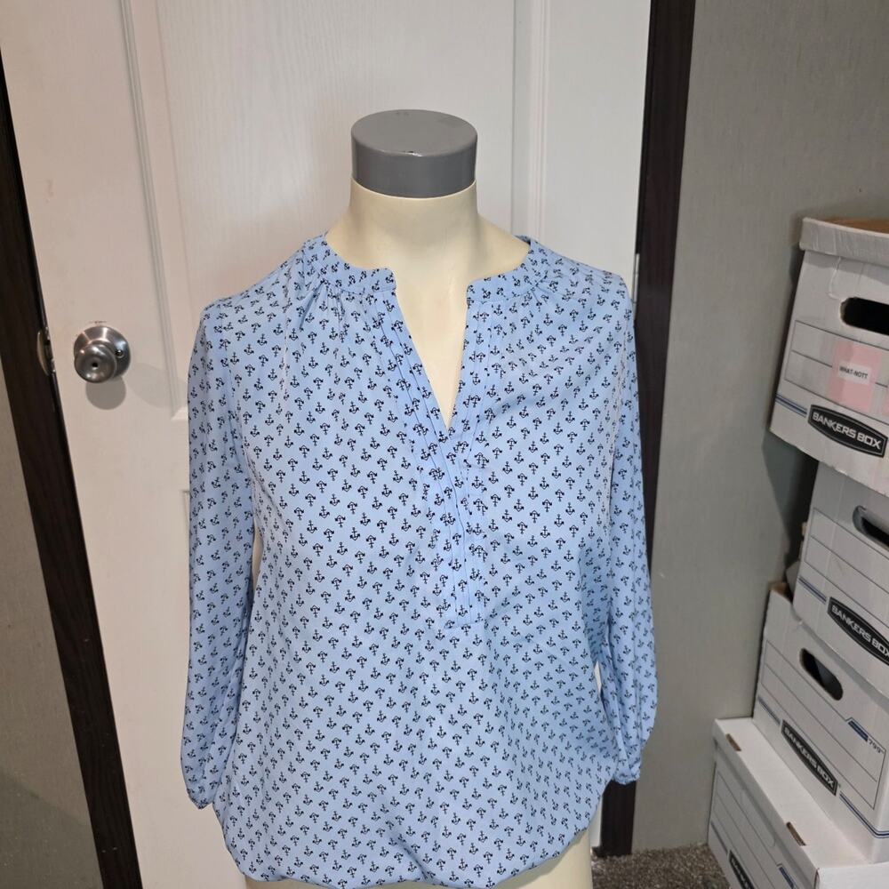Blue blouse top with black anchors on it